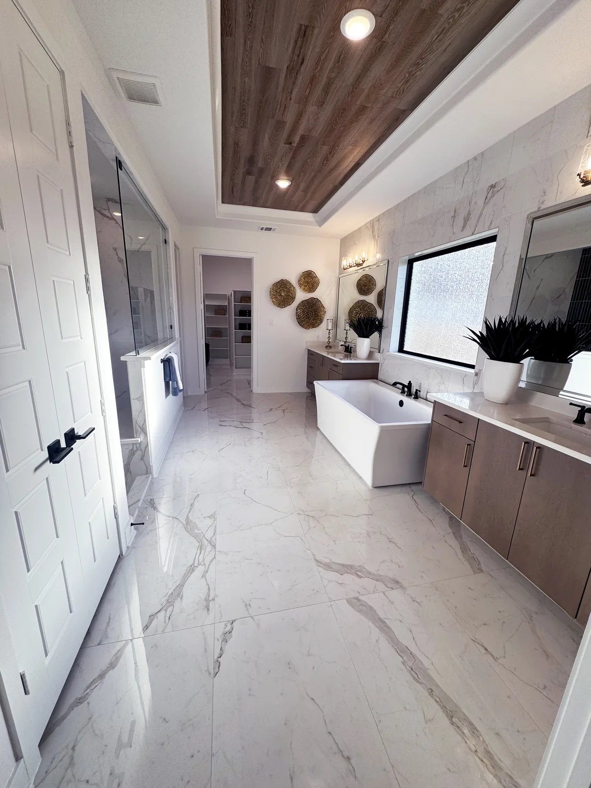 Finished bathroom with custom tile by Drakon Builders