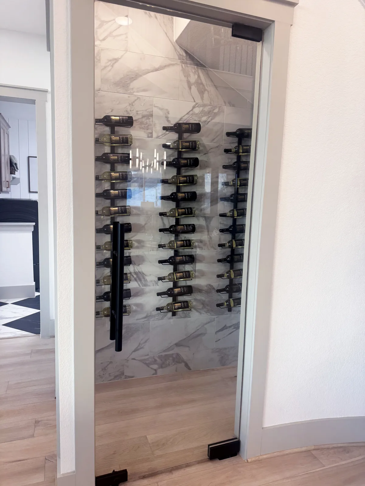 Custom glass wine storage by Drakon Builders