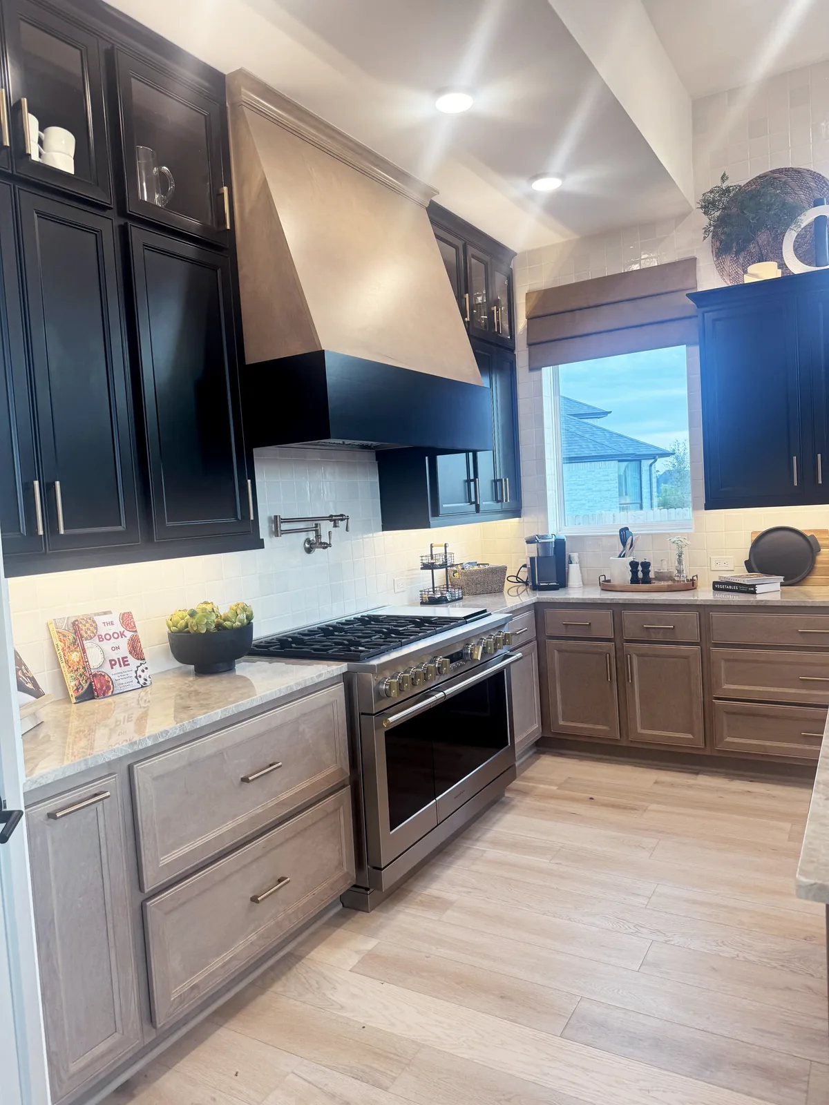 Finished kitchen with custom cabinetry by Drakon Builders